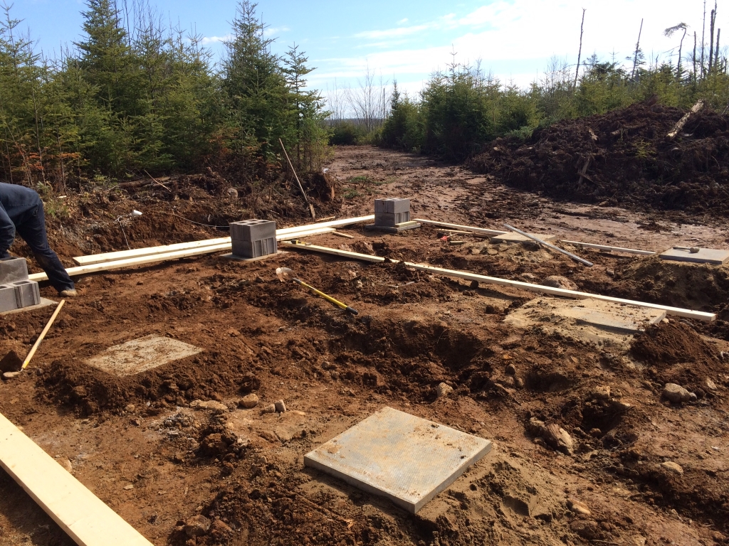 Footing placement for cabin foundations