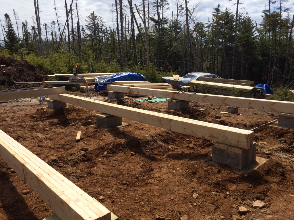 Placing the Off Grid Cabin Floor beams