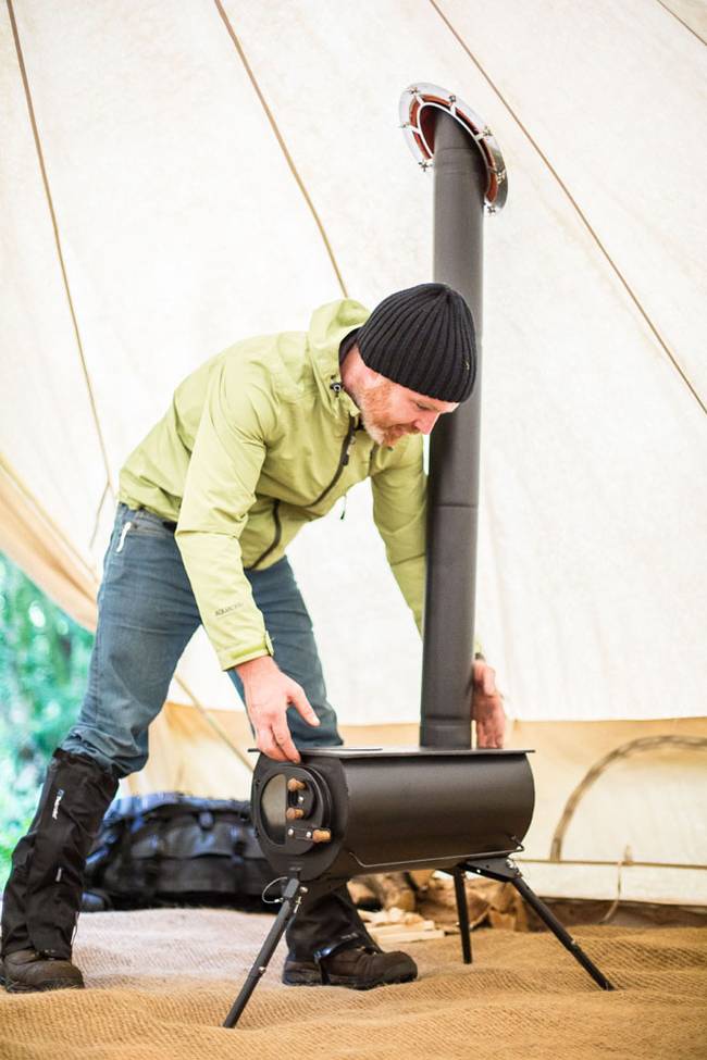 Tent with outlet woodstove