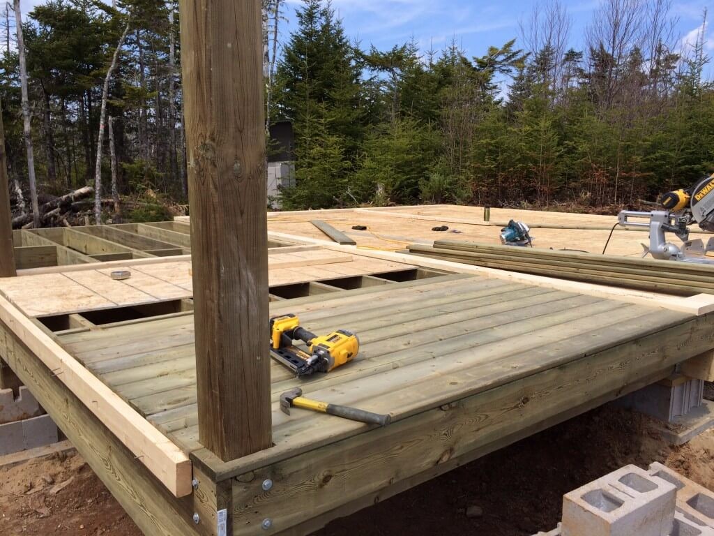 Cabin front deck pressure treated decking install