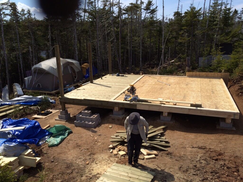 Cabin front deck pressure treated decking install complete 3