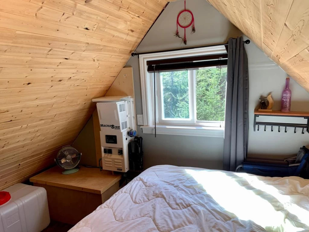 Fresh-water reservoir beside the bed in the cabin loft