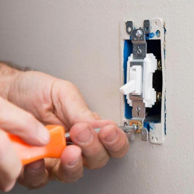 Man installing 3-Way Switch Wiring