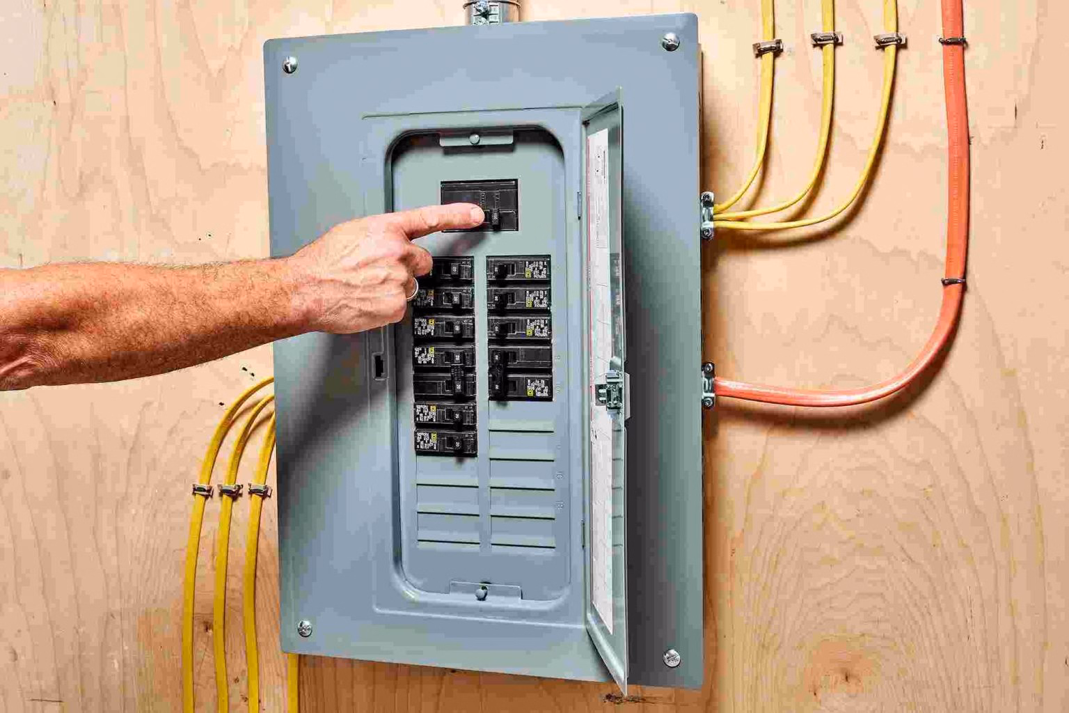 Man shutting off circuit panel